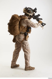 Casey Schneider in Desert Marpat Fighting fighting standing whole body…